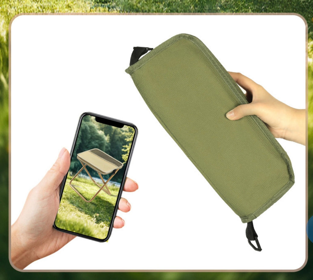 Green pouch held by a hand with a phone showing an image of a folding table in another hand, against a blurred natural background.